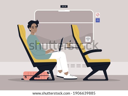 Young male commuter rides a train next to a window, modern lifestyle and travel