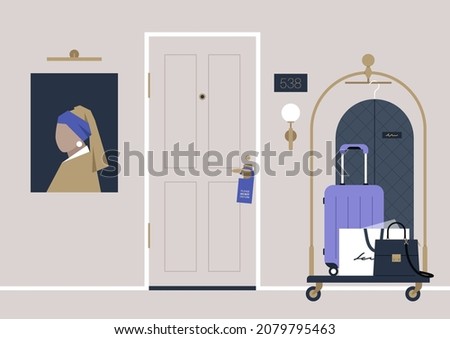 A hotel hallway, a do not disturb sign hanging on a doorknob, a baggage trolley