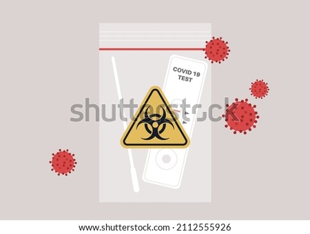 Used coronavirus rapid test kit in a plastic zip bag with a yellow triangle biohazard logo