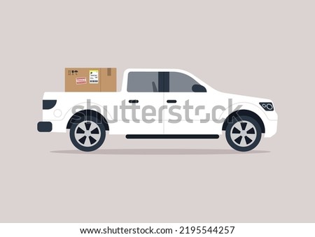 A side view of a big pick up truck loaded with a cardboard box, a cargo transportation concept