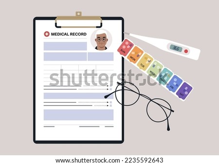 A set of senior patient's medical chart clipped to a clipboard, pill box, glass frames, and plastic thermometer