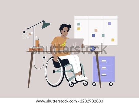 A young Hispanic person using a wheelchair works at a desk in the office