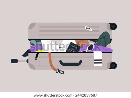 Open suitcase overloaded with clothes and personal belongings, baggage excess