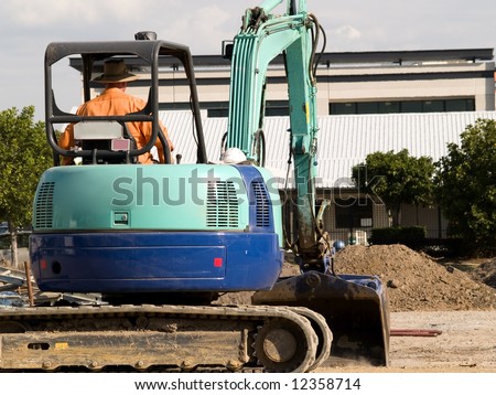 Excavator and driver from the rear