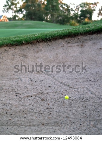 Green Golf Course Series - Yellow golf ball stuck in a sand bunker