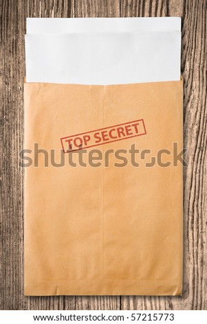 Open yellow envelope with top secret stamp and blank papers, on wooden table, clipping path.
