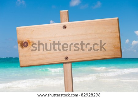 Wood sign in the beach, with clipping path.