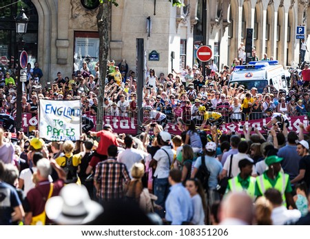 PARIS, JUL 22: Massive crowd of spectators enjoy the passing of the peloton in the final stage of Le Tour de France 2012 on the Avenue des Champs Elysees on 22 July 2012 in Paris,France.