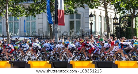 PARIS, JUL 22:The peloton riding during the final stage of Le Tour de France 2012 on Avenue des Champs Elysees on 22 July 2012 in Paris,France.