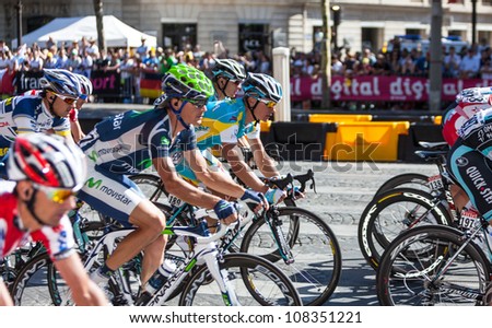 PARIS, JUL 22:The peloton riding during the final stage of Le Tour de France 2012 on Avenue des Champs Elysees on 22 July 2012 in Paris,France.