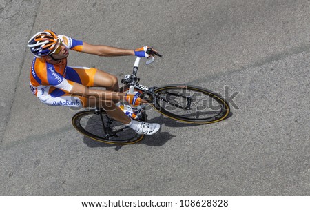 ROUEN, FRANCE - JULY 5 :Upper view of the Belgian cyclist Wynants Maarten (Rabobank Cycling Team) riding to the start line of the stage 5 of Le Tour de France in Rouen, France on July 5, 2012.