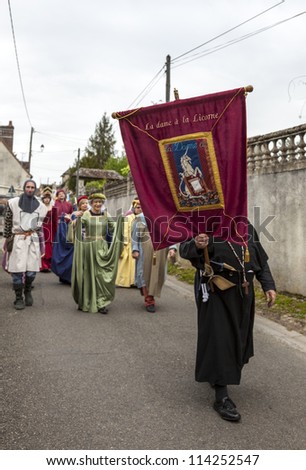 NOGENT LE ROTROU,FRANCE,MAY 19:Parade of medieval characters marching near the Saint Jean Castle during a historical reenactment festival on May 19,2012 in Nogent le Rotrou,France.