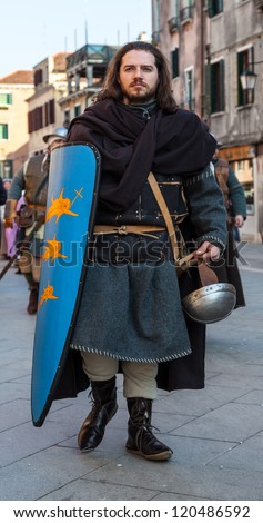VENICE,ITALY-FEB. 26:Unidentified medieval soldier marching in a medieval characters parade on February 26, 2011 in Venice. In 2011 the Venice Carnival was held between 11- 21 February.