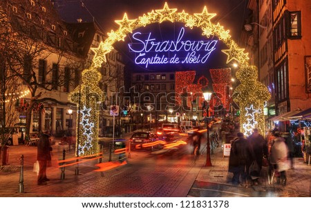 STRASBOURG, FRANCE, DEC 12: People walking on the street during the festive Christmas illumination on December 12 2012 in Strasbourg. In winter here is held a famous Christmas market and illumination.