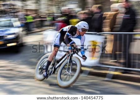 HOUILLES,FRANCE-MARCH 3:Panning image of Dutch cyclist Kruijswijk Steven from Blanco Pro Cycling Team, riding during the prologue of the cycling road race Paris- Nice 2013 in Houilles on March 3 2013