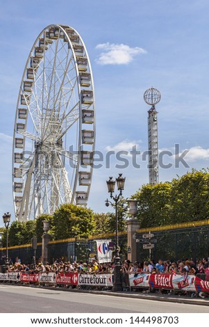 PARIS, JUL 22:Crowd of spectators waiting for the peloton on the Rue de Rivoli, near Tuileries Garden in Paris during the during the final stage of Le Tour de France on 22 July 2012 in Paris,France.