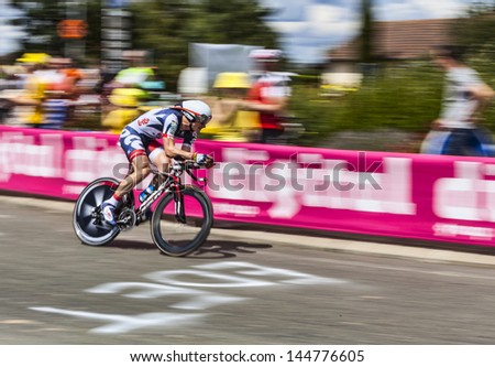 ILLIERS COMBRAY,FRANCE,JUL 21:Panning image of the German cyclist Andre Greipel (Team Lotto Belisol) riding during stage 19- time trial between Bonneval and Chartres- Le Tour de France on July 21 2012