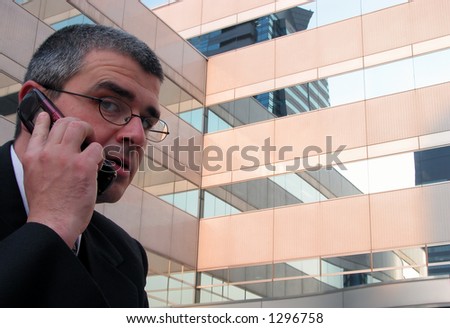 Face expression of a businessman with a mobile phone.