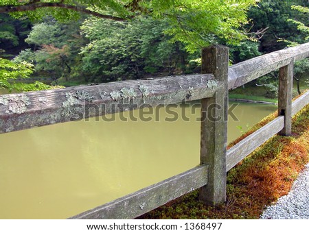 Interesting detail and perspective with an old Japanese wooden bridge in Shyugakuin Imperial Villa,Kyoto,Japan