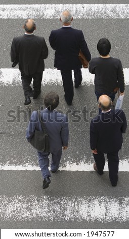 Group of men crossing the street-upper view