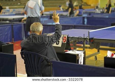 Table tennis referee during a ping-pong competition.