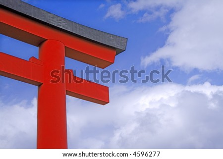 Image of a traditional Japanese temple gate over a cloudy sky.Ideal image to promote any trip to traditional Japan.