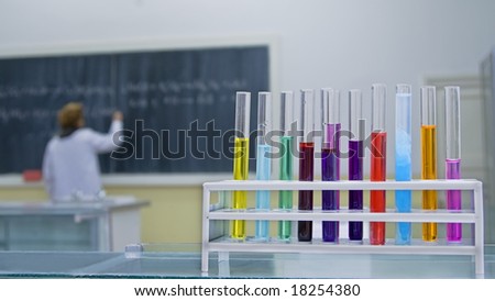 Image in a school chemistry lab.Selective focus on the tubes in foreground.