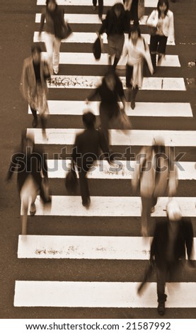 Group of people crossing the street-upper view,sepia tones