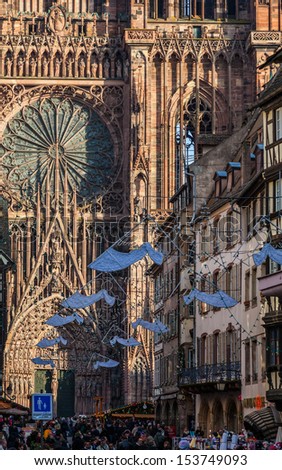 STRASBOURG, FRANCE - DECEMBER 28: Crowd of people on the Rue de Merciere street leading to the Cathedral Square on December 28 2011 in Strasbourg. In winter here is held a famous Christmas market .