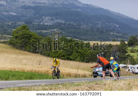CHORGES, FRANCE- JUL 17:The winner of Le Tour de France 2013,Christopher Froome (Sky Procycling) wearing the Yellow Jersey during the 17 stage- a time trial between Embrum and Chorges  on July 17 2013