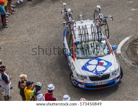 PORT DE PAILLERES,FRANCE- JUL 6:Technical car of Lotto Belisol procycling team climbing the road to Col de Pailheres in Pyrenees Mountains during the stage 8 of Le Tour de France on July 6, 2013.