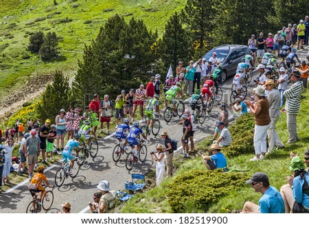 PORT DE PAILHERES,FRANCE- JUL 6:The peloton climbing the road to Col de Pailheres in Pyrenees Mountains during the stage 8 of Le Tour de France on 6 July 2013.