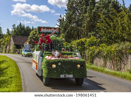ILLIERS-COMBRAY,FRANCE,JUL 21:The vehicle of the Ajourd\'hui Magazine driving on a rural road,during the 19th stage- a time trial between Bonneval and Chartres- of \