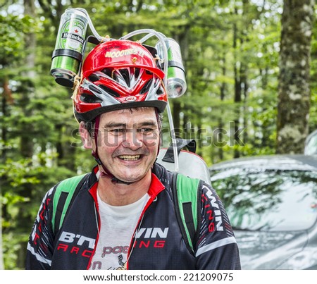 LE MARKSTEIN, FRANCE - JUL 13:Portrait of a funny disguised fan of le Tour de France on the road to the mountain pass Le Markenstein during Le Tour de France on July 13, 2014.