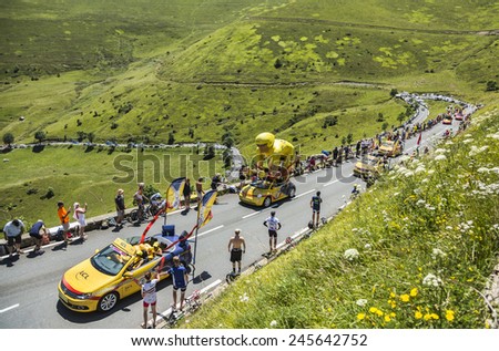 COL DE PEYRESOURDE,FRANCE- JUL 23:LCL caravan on the road to Col de Peyresourde in Pyrenees Mountains during the passing of the Publicity Caravan  - stage 17 of Le Tour de France on 23 July 2014.