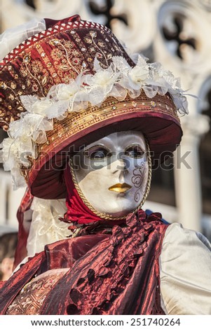 VENICE-FEB 18: Portrait of a person wearing a beautiful mask and disguise on February 18, 2012 in Venice. In 2014 the Venice Carnival will be held between January 31- February 17