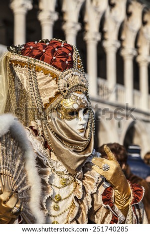 VENICE-FEB 18:Environmental portrait of a person in a traditional Venetian mask  on February 18, 2012 in Venice. In 2014 the Venice Carnival will be held between January 31- February 17