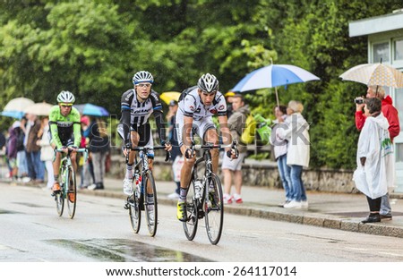 GERARDMER,FRANCE - JUL 12:Three cyclists, Florian Guillou,Albert Timmer and Maarten Wynants ride during the stage 8 of Le Tour de France on July 12, 2014 in Gerardmer