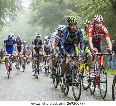 COL DU PLATZERWASEL, FRANCE - JUL 14:The peloton on the climbing road to mountain pass Platzerwasel in Vosges Mountains, during the stage 10 of Le Tour de France on July 14 2014