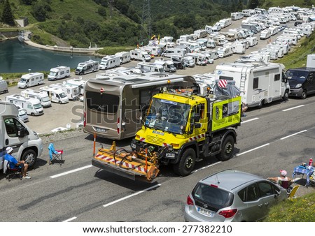 COL DU TOURMALET,FRANCE-JUL 24:Technical truck which assure the good status of the roads passing before the cyclists on the road to Col de Tourmalet in the stage 18 of Le Tour de France 2014