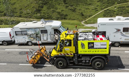COL DU TOURMALET,FRANCE-JUL 24:Technical truck which assure the good status of the roads passing before the cyclists on the road to Col de Tourmalet in the stage 18 of Le Tour de France 2014