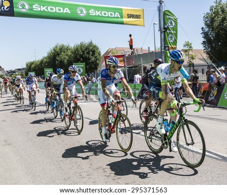 ARGENTAN, FRANCE - JUL 10: The peloton riding after crossing the line of the intermediate sprint in Argentan during Tour de France on 10 July 2015.
