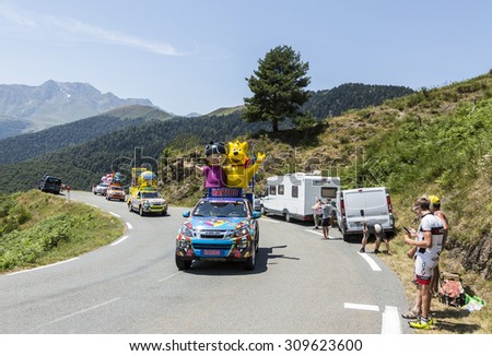 COL D\'ASPIN,FRANCE - JUL 15:Haribo Caravan during the passing of the Publicity Caravan on the Col d\'Aspin in Pyerenees Mountains during the stage 11 of Le Tour de France on Juy 15, 2015.