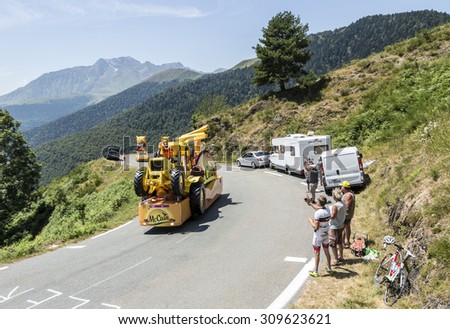 COL D\'ASPIN,FRANCE - JUL 15: Mc Cain Caravan during the passing of the Publicity Caravan on the Col d\'Aspin in Pyerenees Mountains during the stage 11 of Le Tour de France on Juy 15, 2015.