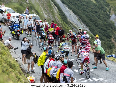 COL DU GLANDON, FRANCE - JUL 24: Group of four cyclists including Polka Dot Jersey,Joaquim Rodriguez ,climbing the road to Col du Glandon in Alps, during Le Tour de France on July 24, 2015.