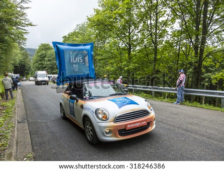 LE MARKSTEIN, FRANCE - JUL 13: Ibis Budget Hotel vehicle during the passing of the Publicity Caravan on the road to mountain pass Le Markstein during the stage 9 of Le Tour de France on July 13, 2014