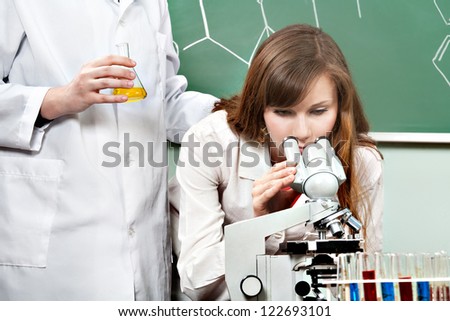 Lab workers working with chemical lab equipment