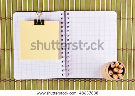 Office supplies on bamboo pad
