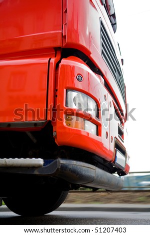 Moving red truck from ground level