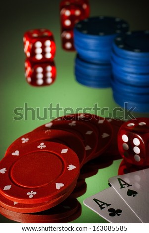 Poker dices, dice and two aces with reflection